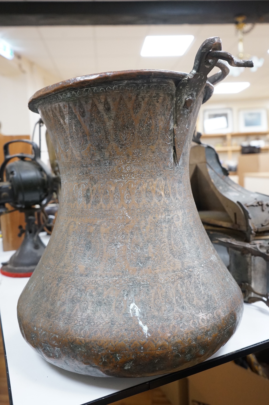 A large Indian copper water pot, 38cm high